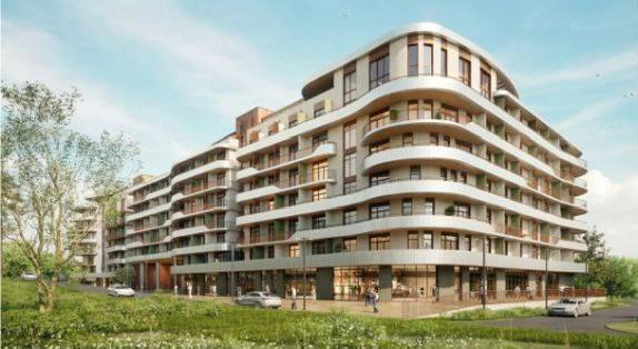 Архитектурная визуализация фасада апарт‑комплекса у моря: округлые формы, балконы, остекление и зелёные газоны перед зданием.