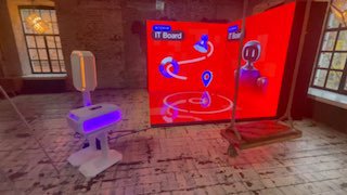 Угловая LED‑фотозона в помещении: крупный светодиодный экран на полу и сзади и отдельная фотостойка с нейросетью для обработки снимков.