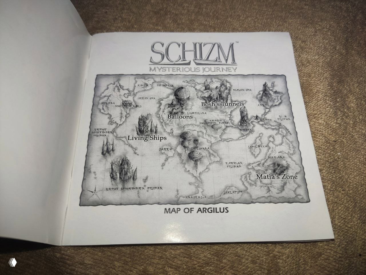 Чёрно‑белая карта мира "Map of Argilus" из мануала Schizm, изображены зоны, подписи и обозначения локаций.