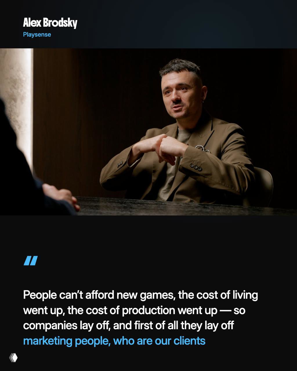 Alex Brodsky seated in a dark studio-style interview, mid-shot as he explains how creative agencies in gaming can be easy to start and the market pressures they face.