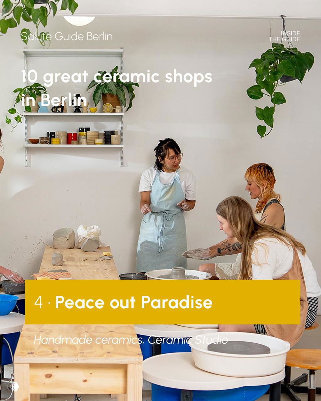 Group workshop scene in a Berlin ceramic studio with people shaping clay at a table, tools and raw clay visible — an active class environment.