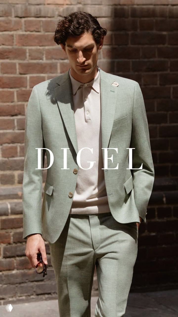 Мужской костюм пастельного зелёного оттенка от DIGEL в уличной съёмке; лёгкие ткани и свободный силуэт создают современную спокойную эстетику.