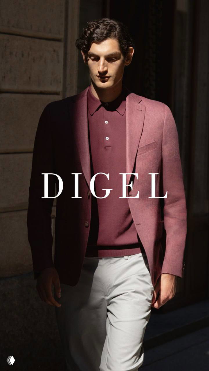 Модель в бордовом пиджаке и рубашке DIGEL; контрастный, но сдержанный образ демонстрирует вариативность палитры и вечернюю элегантность бренда.