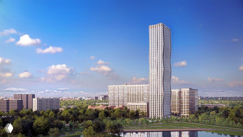 Общий панорамный вид на небоскрёб и примыкающие корпуса комплекса: современный силуэт над зелёной зоной и городской линией горизонта.