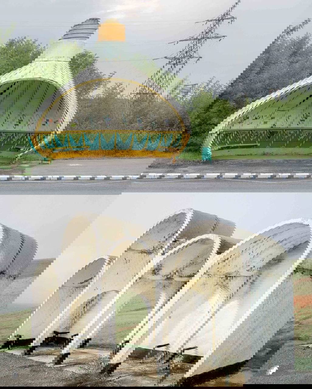 Гигантская скульптурная композиция и остановка, украшенная флагом и статичной фигурой на фоне ровного поля и неба.